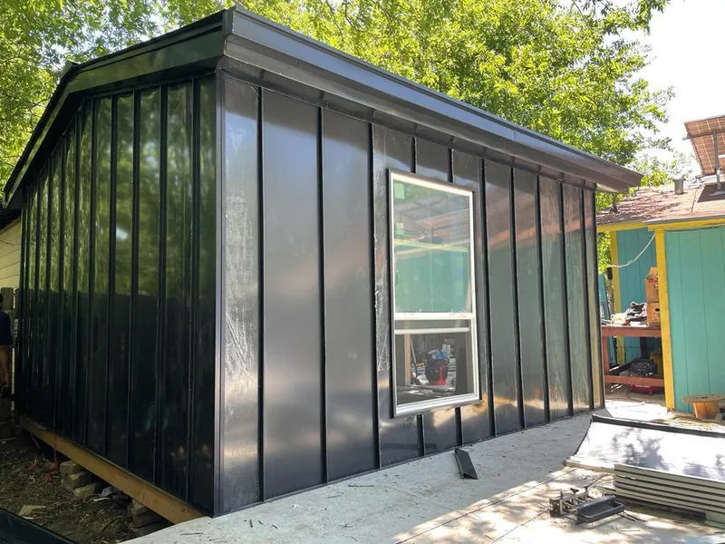 Black standing seam metal wall panels for Roof Inspection in Oscoda