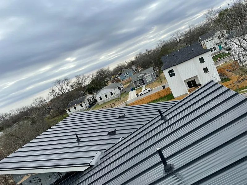 Standing seam metal roof panels with vents for Skylight Repair in Oscoda